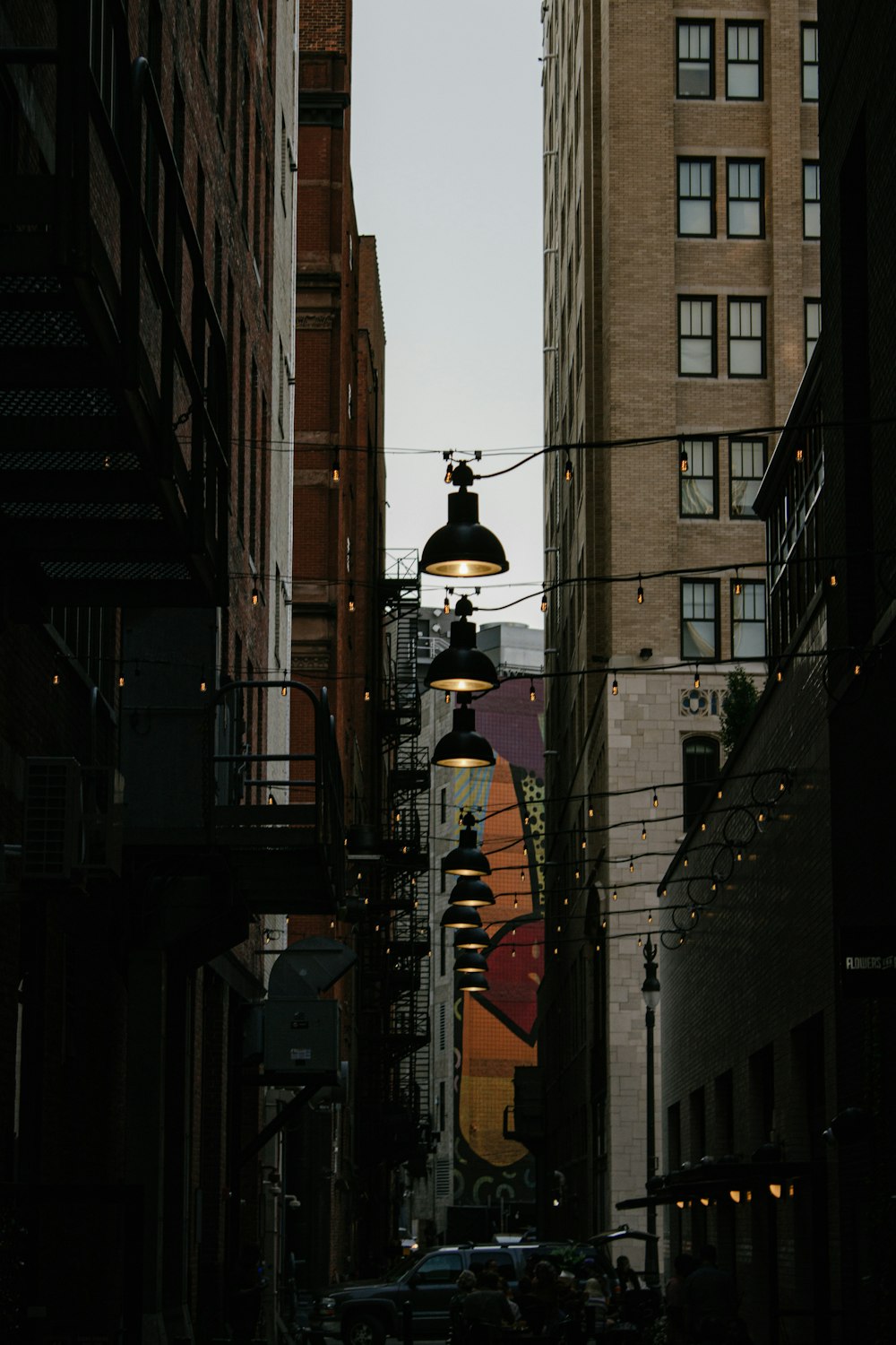 a city street with tall buildings and a street light