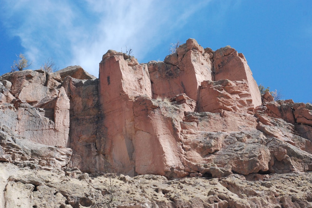 a rock formation with a sky in the background