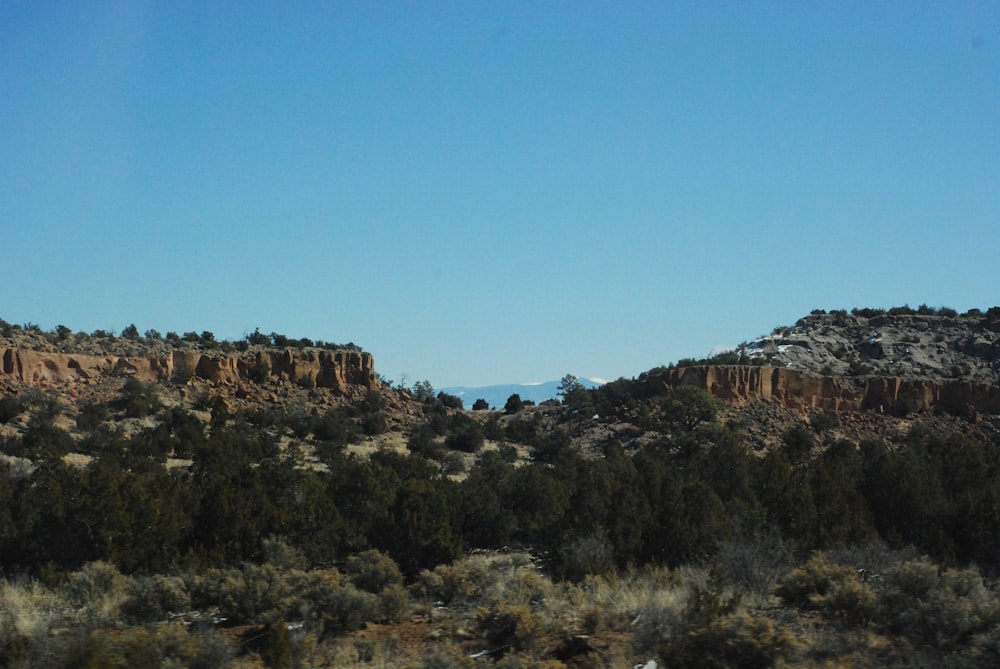 a view of a mountain range from a moving vehicle