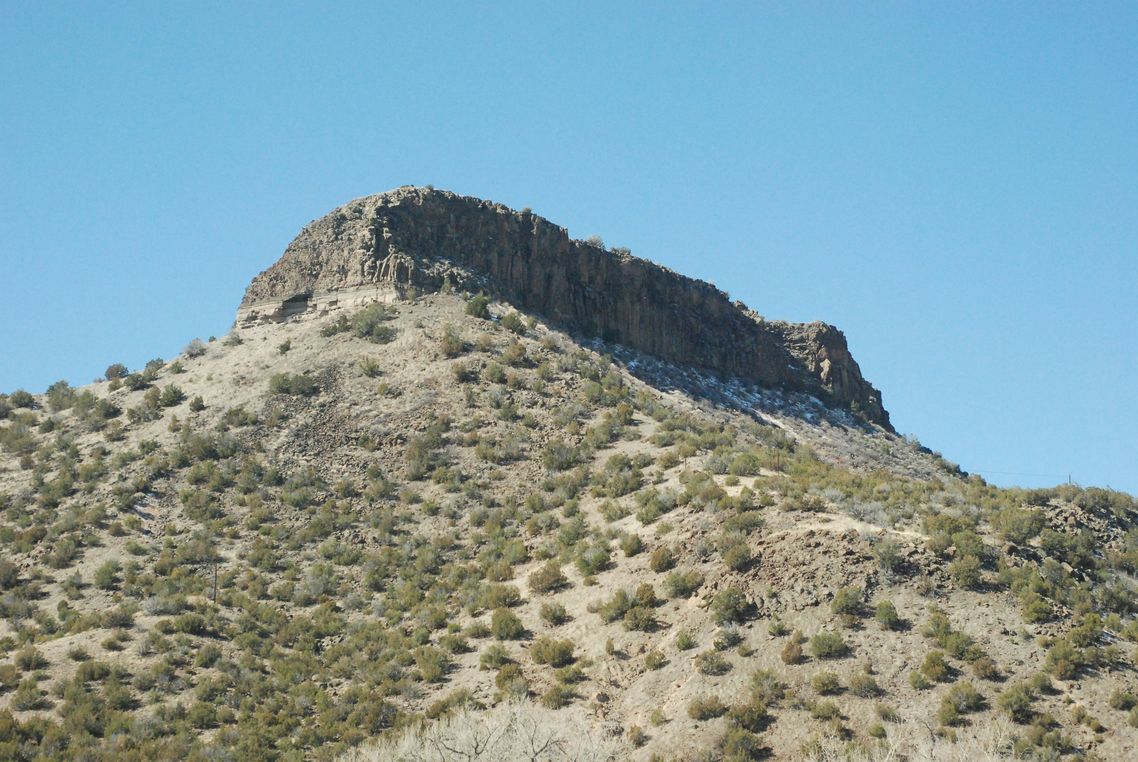 a very tall mountain with a sky background