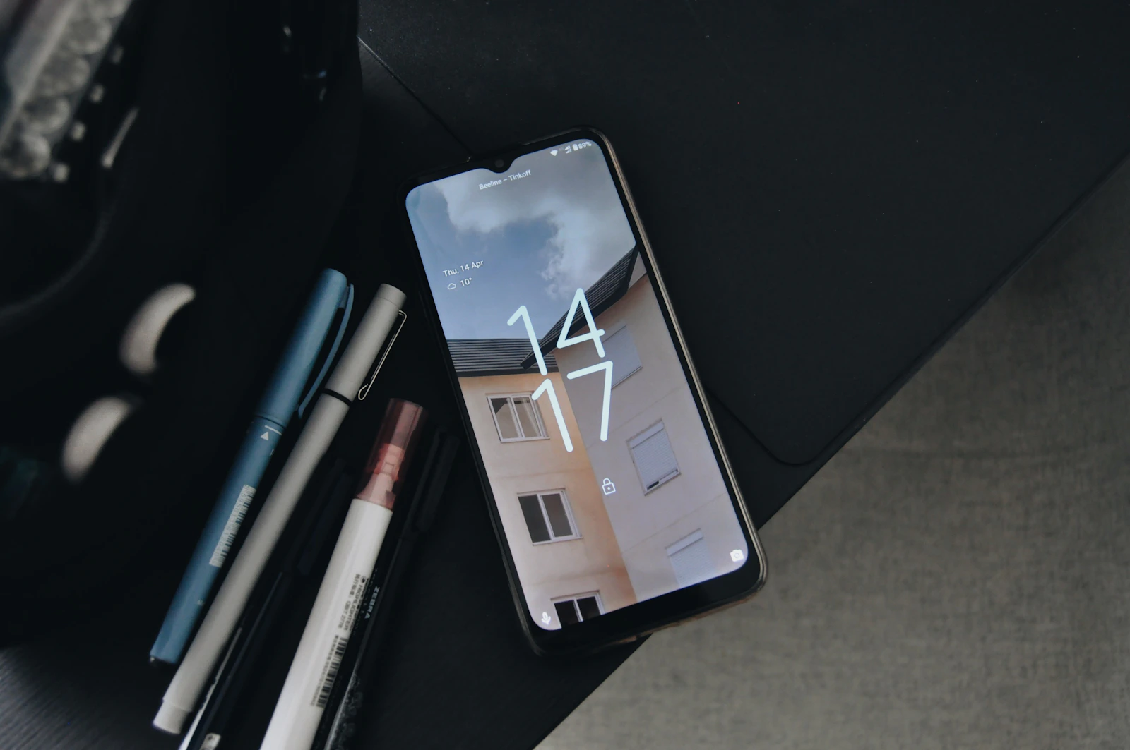 Phone resting alone on a table, symbolizing an unsent breakup message and the decision not to make contact