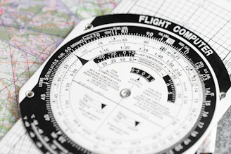 a close up of a compass on a map