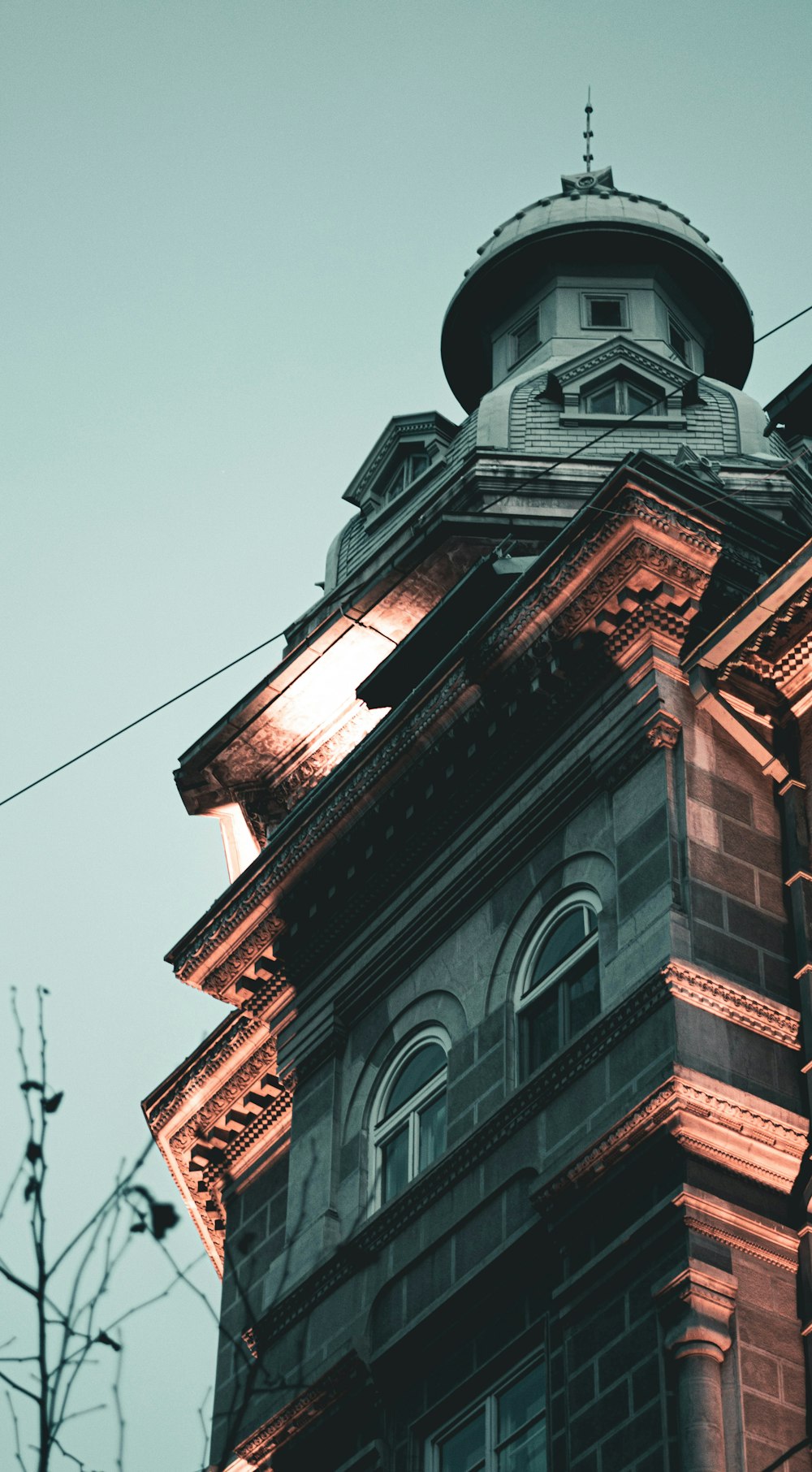 a tall building with a clock on the top of it