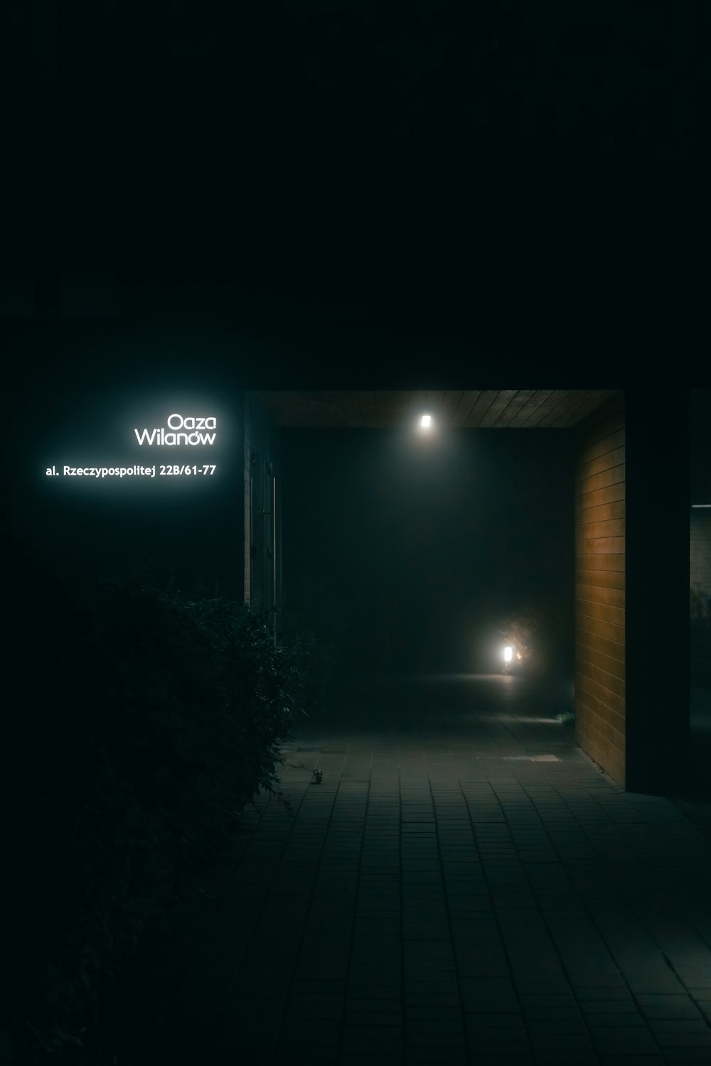 a dimly lit entrance to a building at night