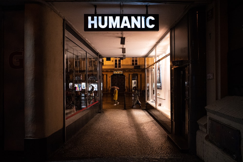 a dimly lit hallway leading to a store