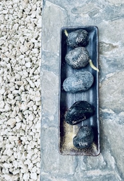 Four natural elements symbolized: earth, water, fire, and air in an artistic arrangement