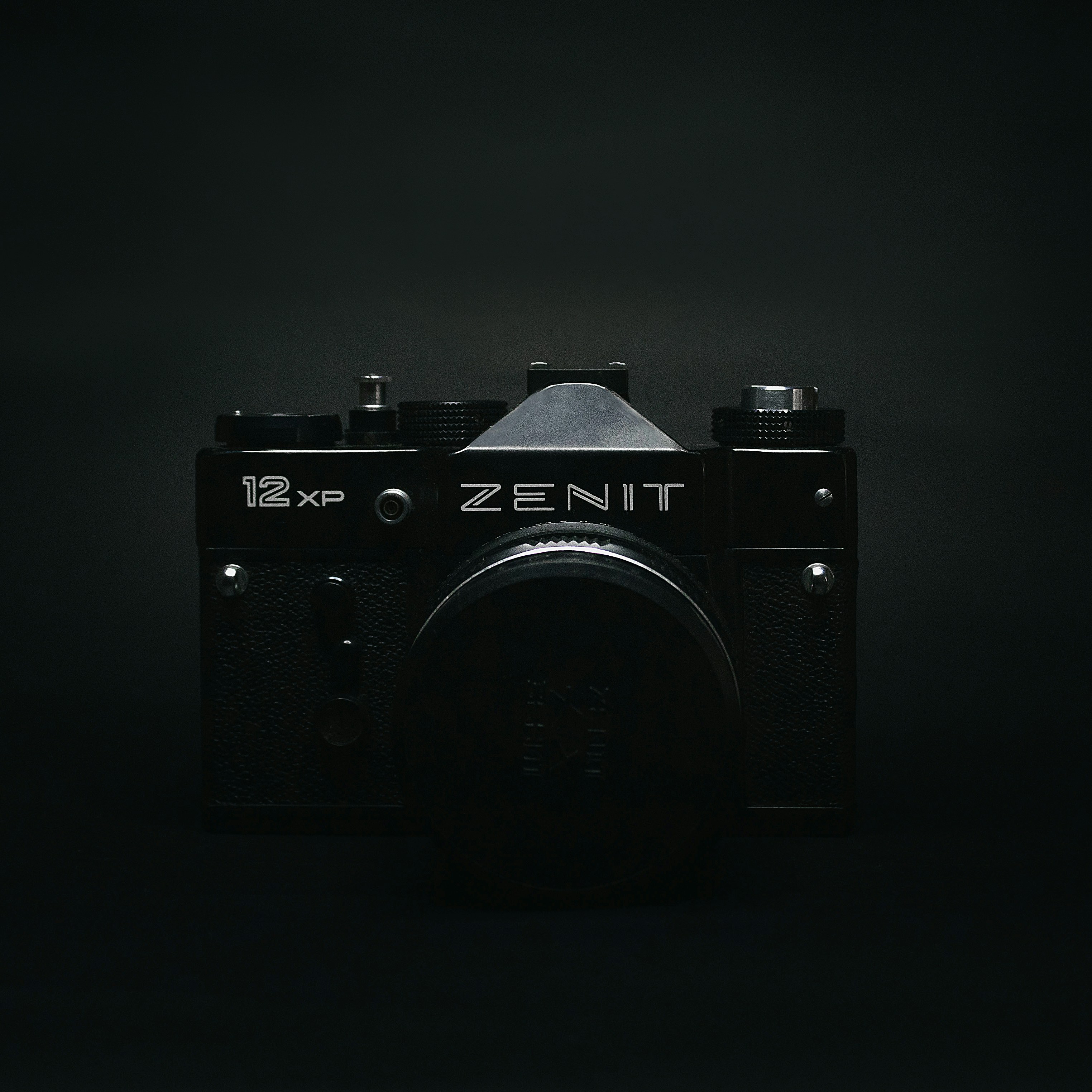 a black camera with a black background