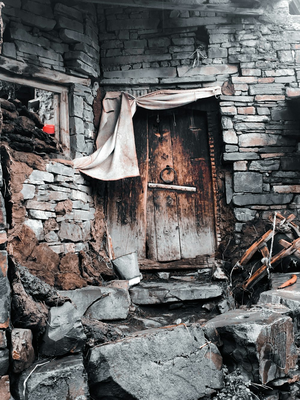 an old brick building with a wooden door