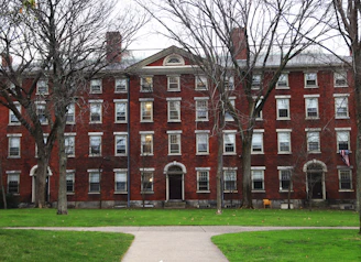 a red brick building with trees in front of it