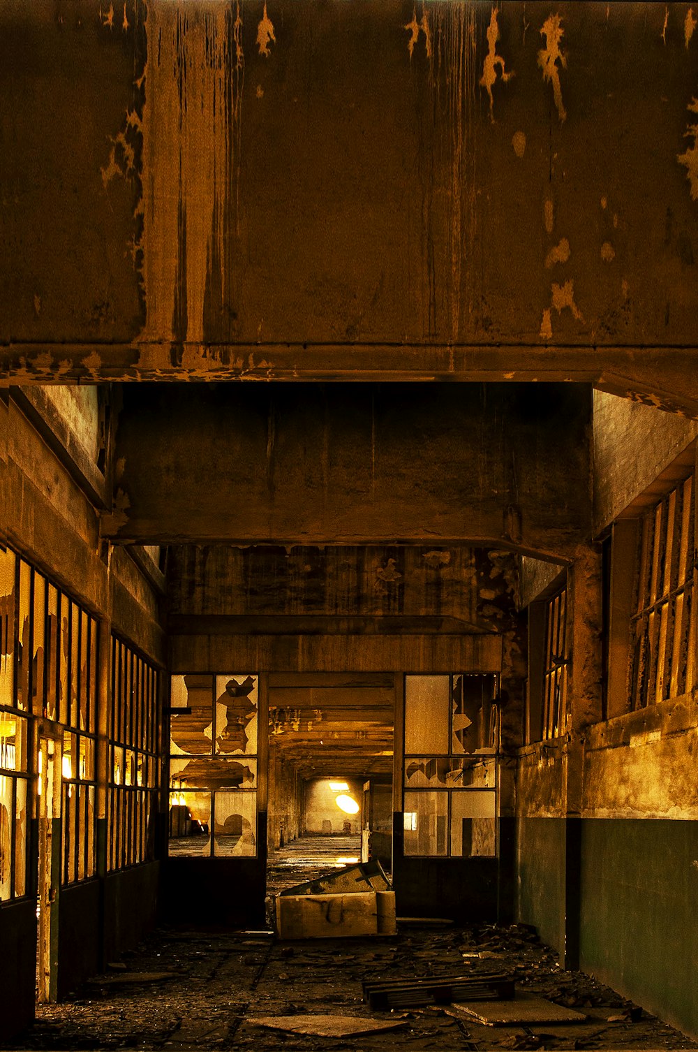 an abandoned building with a bed in the middle of the room