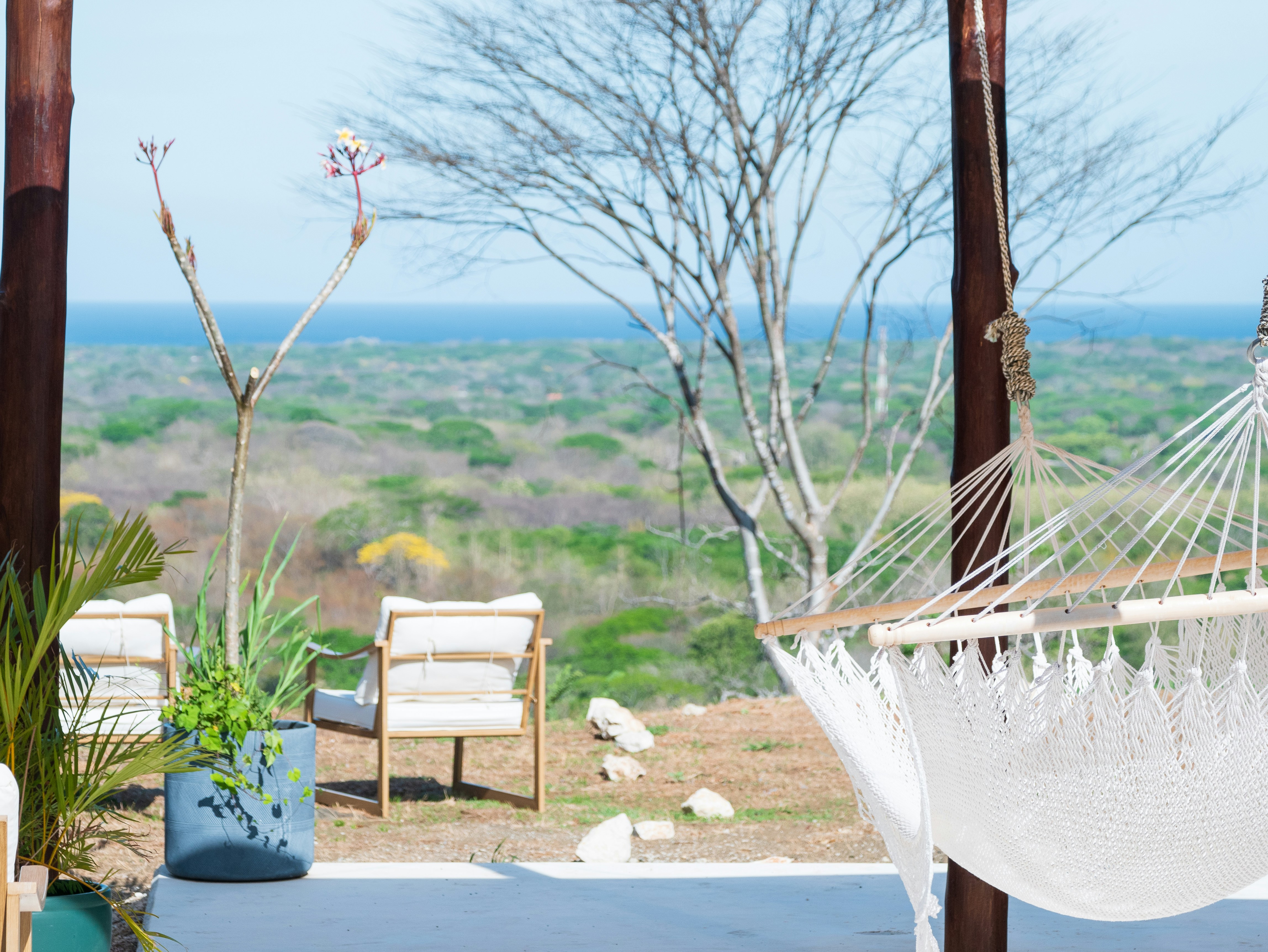 a white hammock sitting on top of a patio