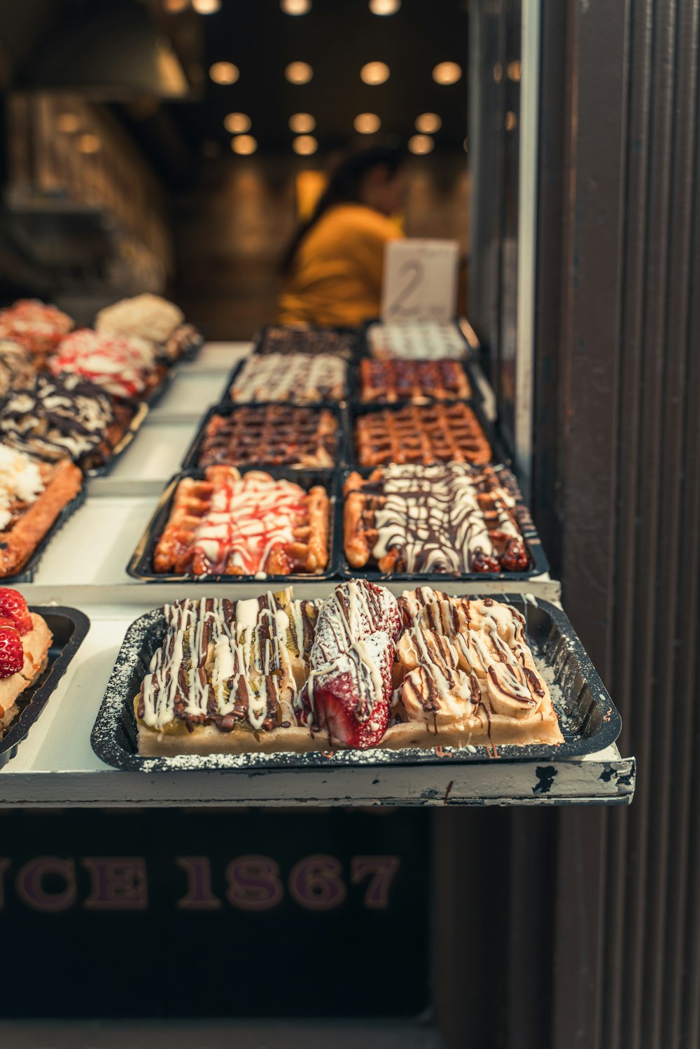 a display of different types of waffles and pastries