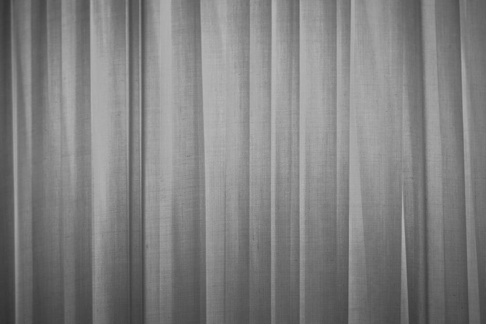 a black and white photo of a curtain