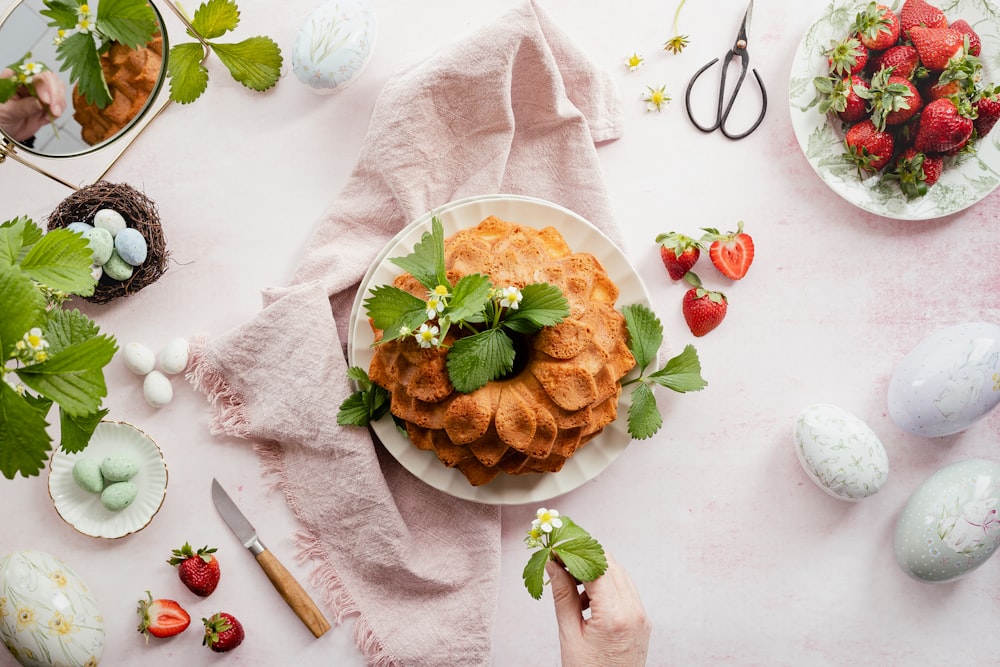 a plate of food with strawberries on it