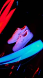 Vibrant running shoes in motion on a track with blurred background