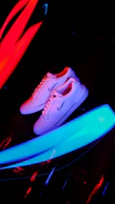 Vibrant running shoes in motion on a track with blurred background