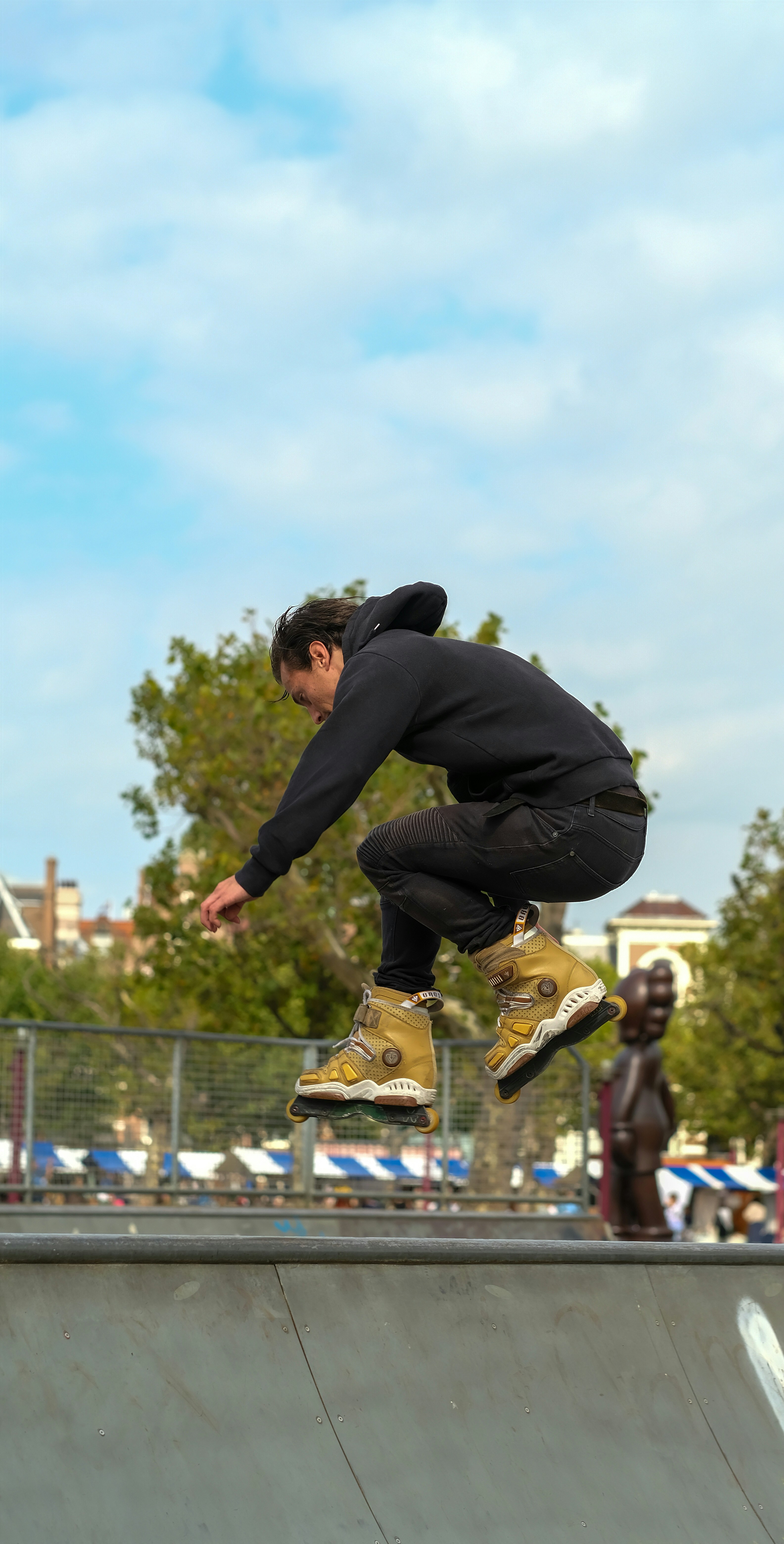 A man riding a skateboard up the side of a ramp photo – Free Human ...