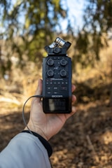 a person holding a camera in their hand