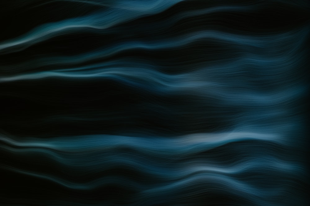 a blurry image of a black and blue background