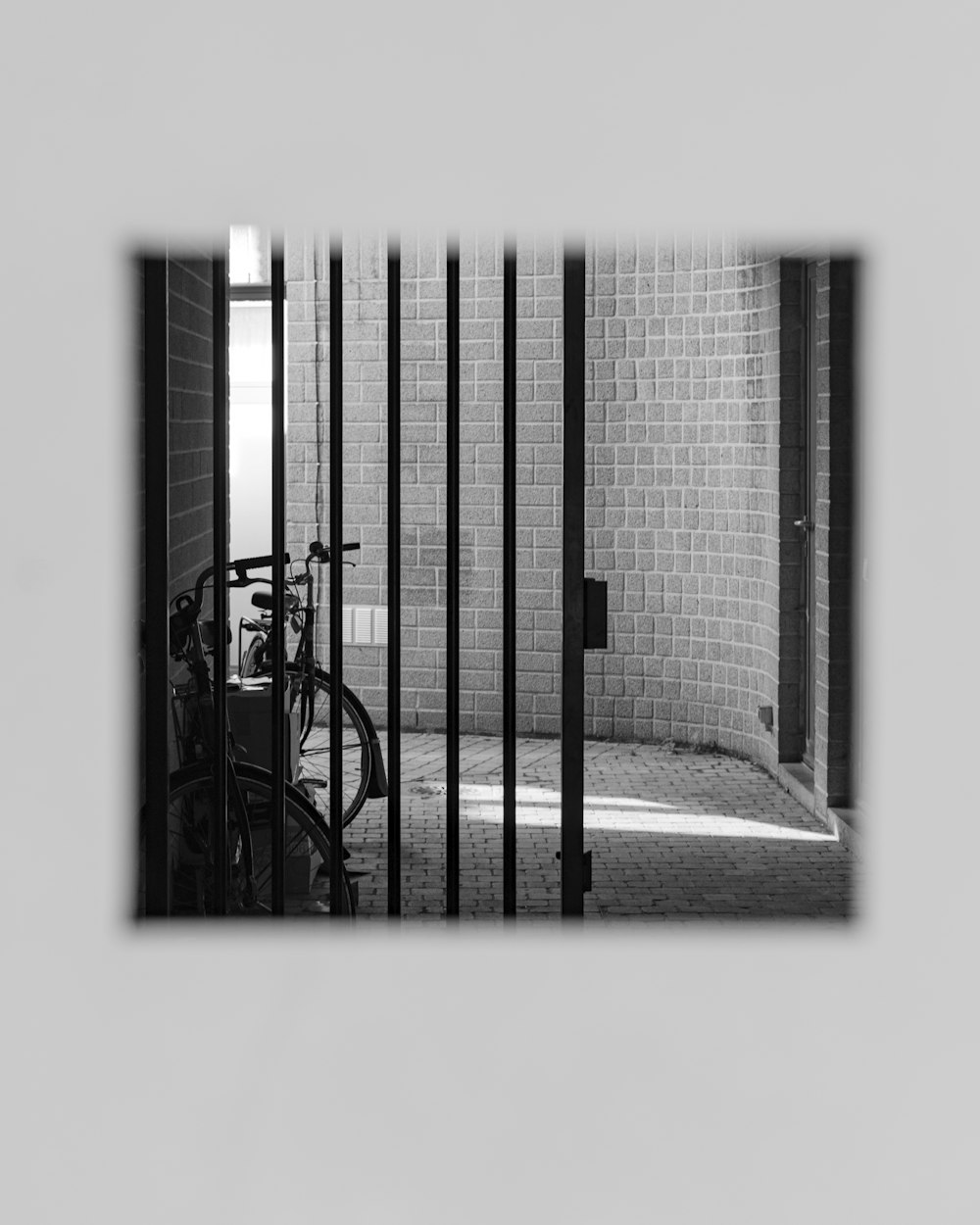 a black and white photo of a bike in a building