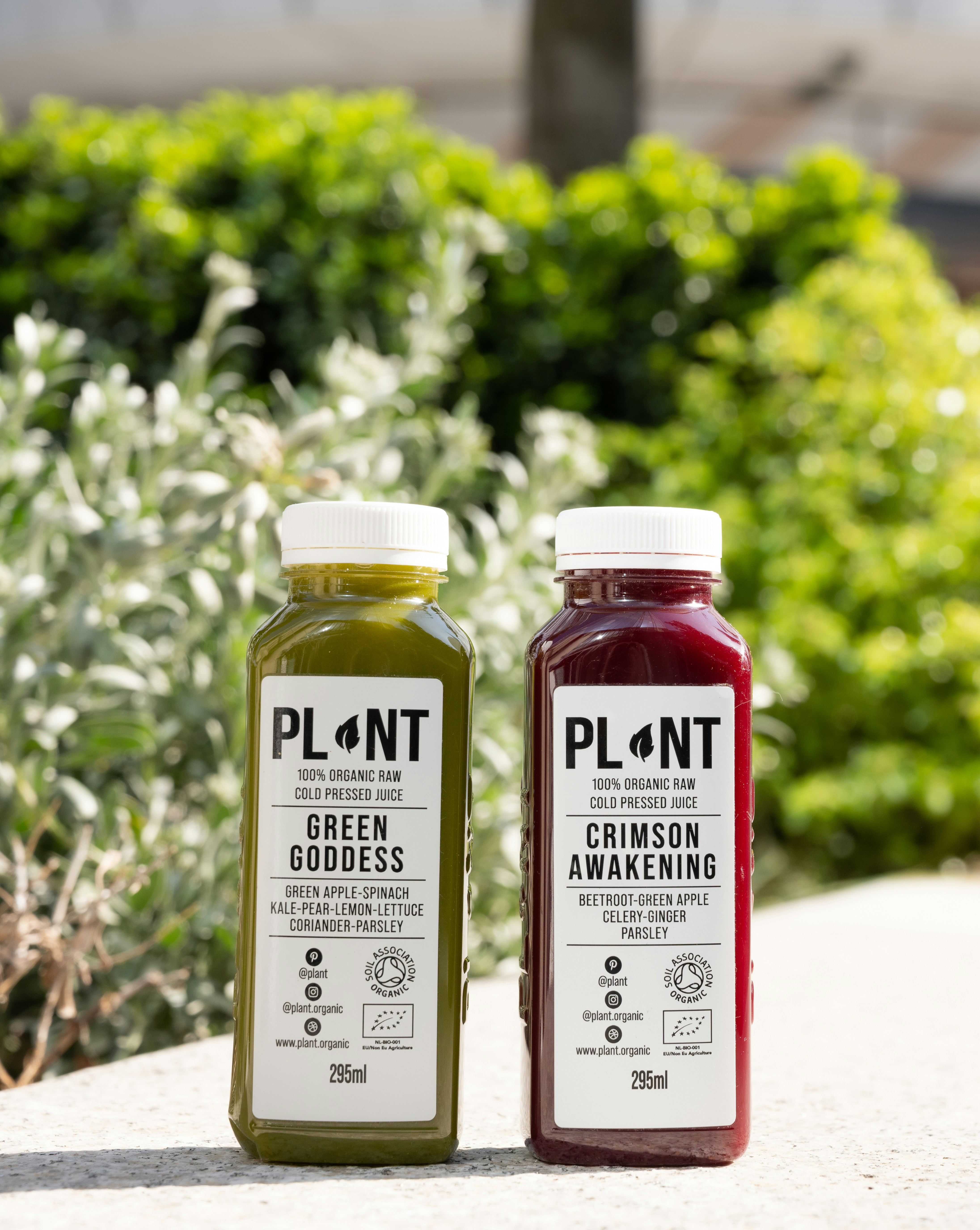 a couple of bottles of juice sitting next to each other