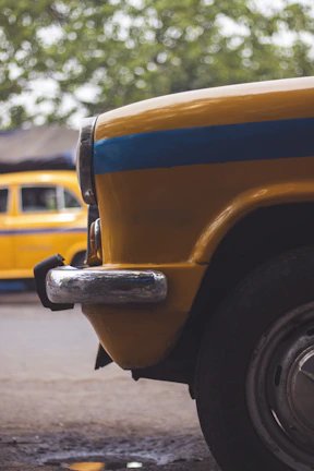 Side view of a taxi with a visible gas tank installed on the rear