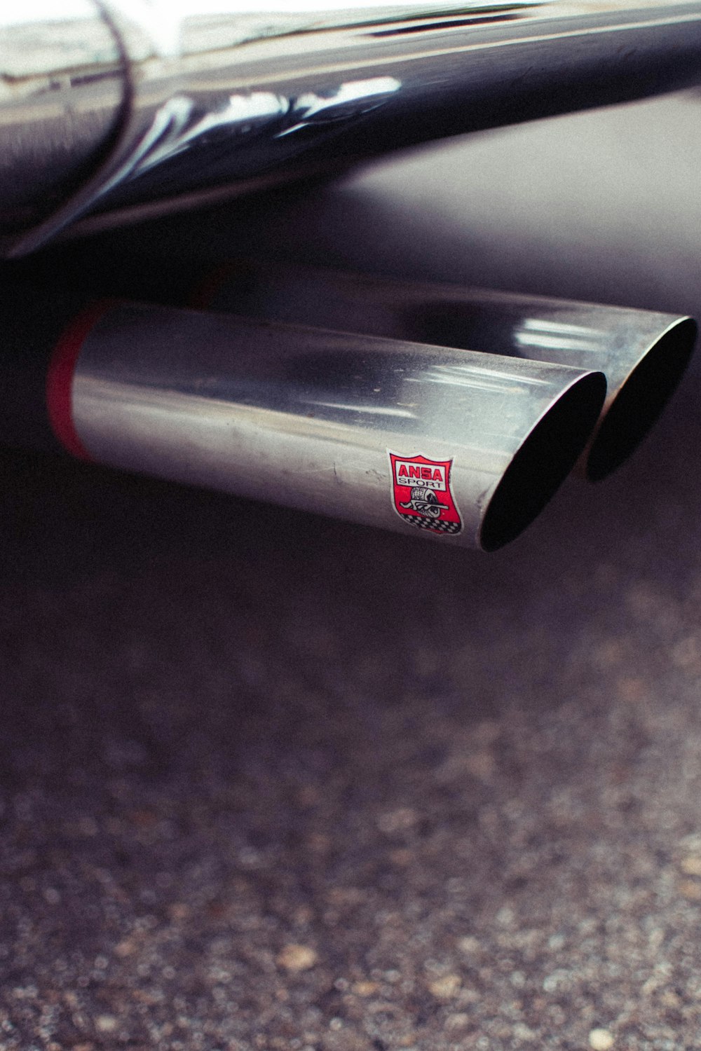 a close up of a exhaust pipe on a car