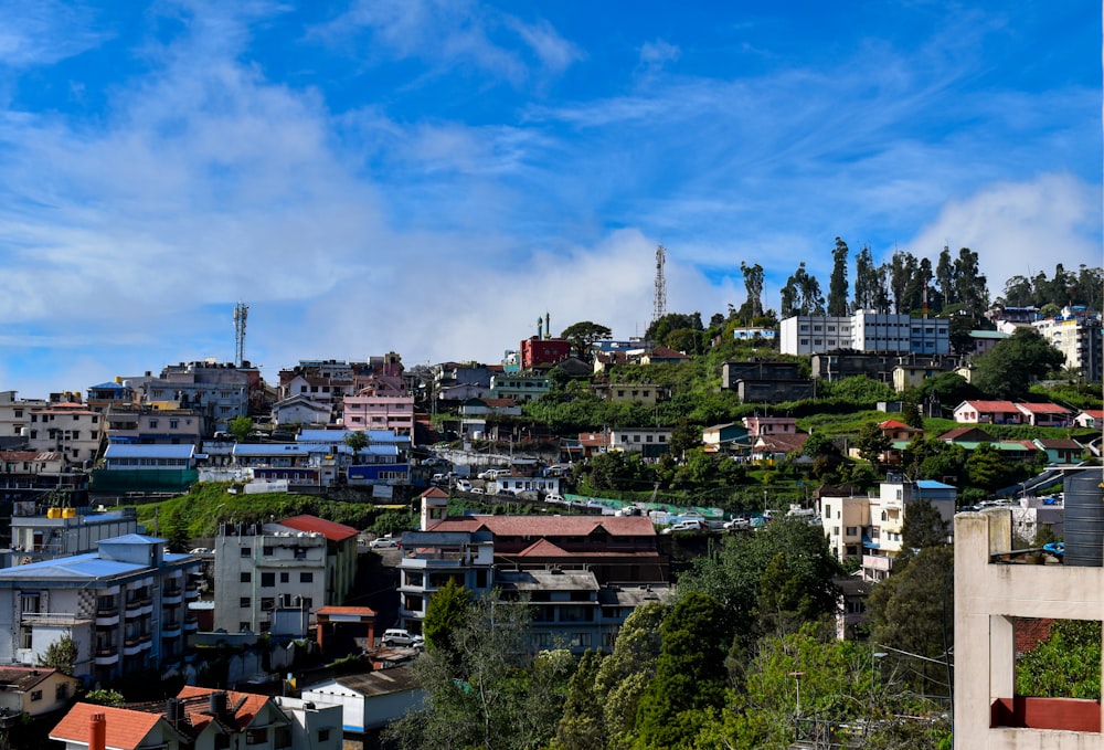 a city with lots of houses on a hill