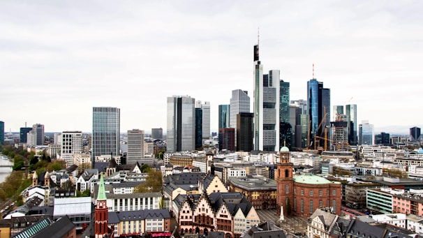 A bustling European city skyline showcasing historic and contemporary architecture.