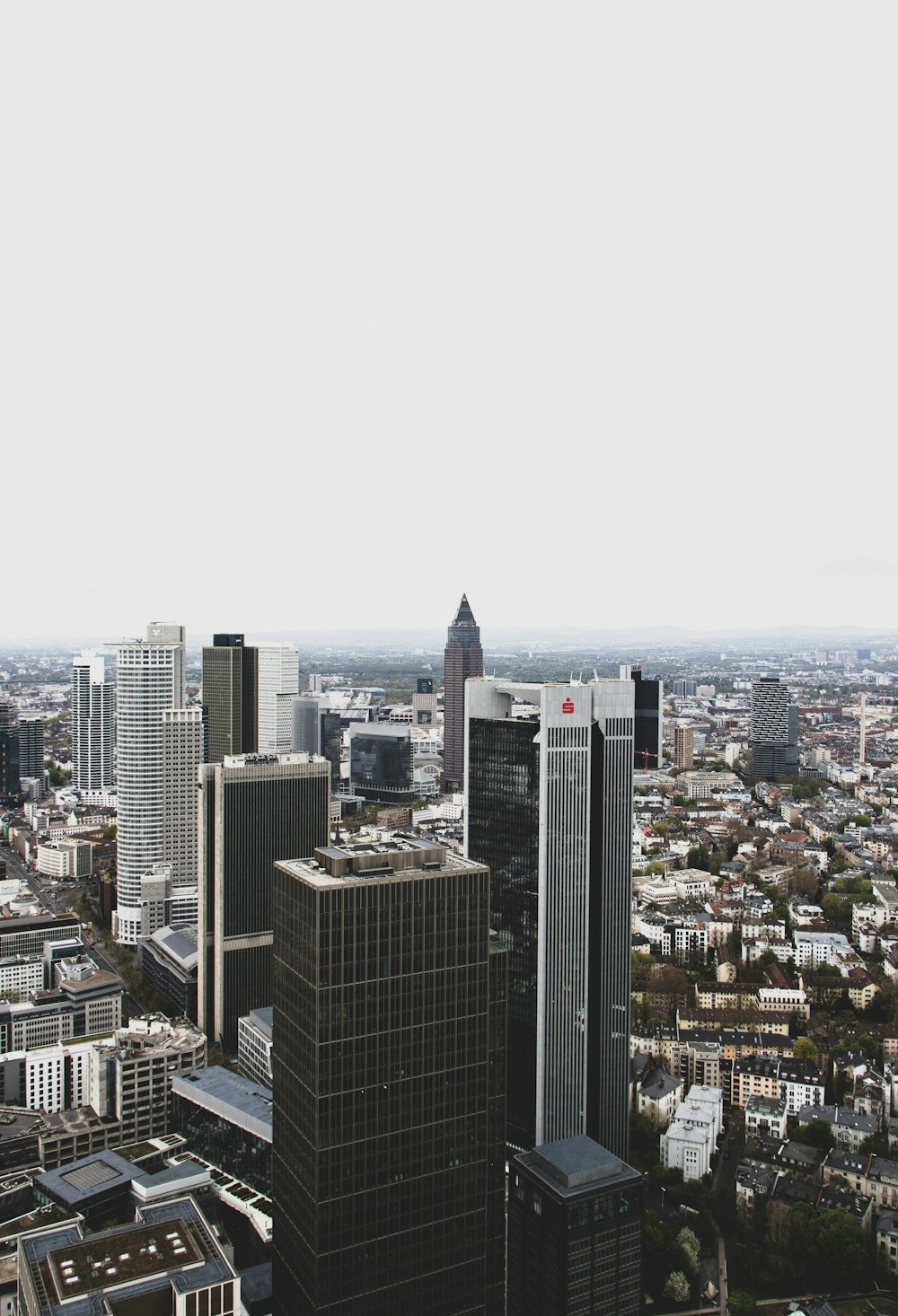 an aerial view of a city with tall buildings