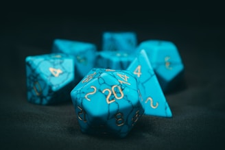 Classic metal dice in traditional shapes and colors.