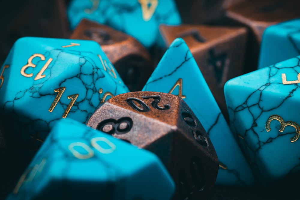a group of blue and brown dice sitting on top of each other