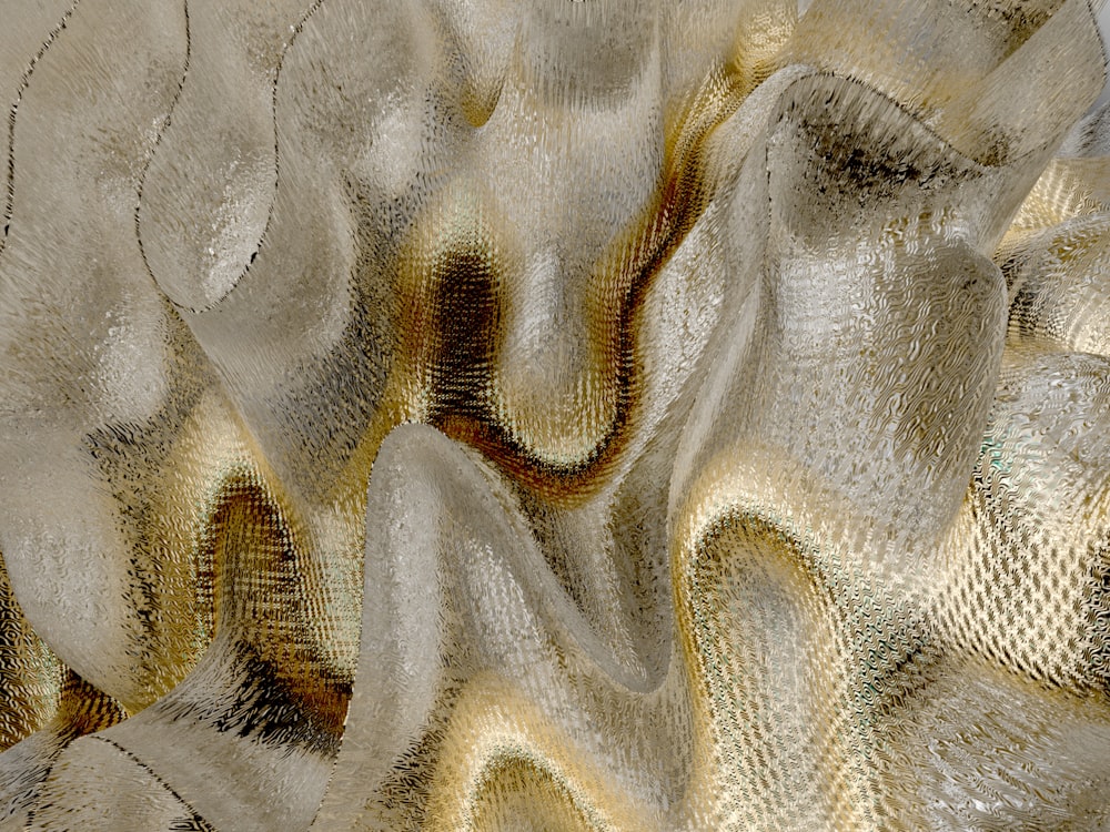 a close up view of a gold and silver fabric