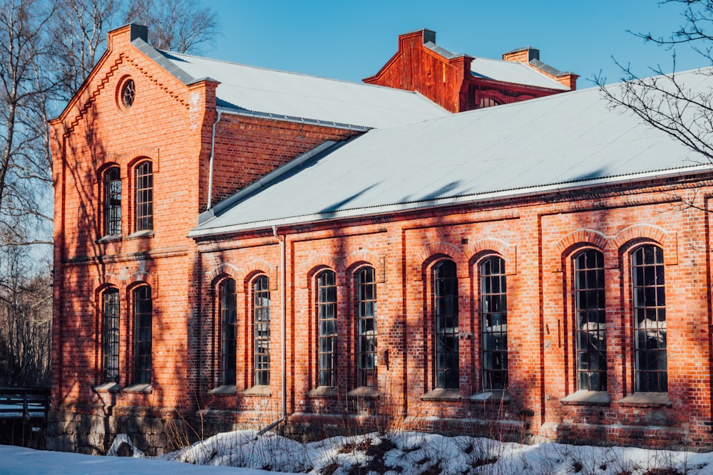 a large brick building with a white roof