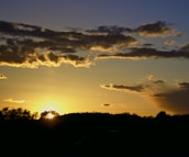 A serene landscape at sunset, symbolizing the passage of time and memories.