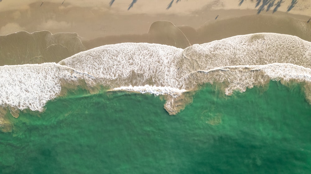 an aerial view of a beach and ocean