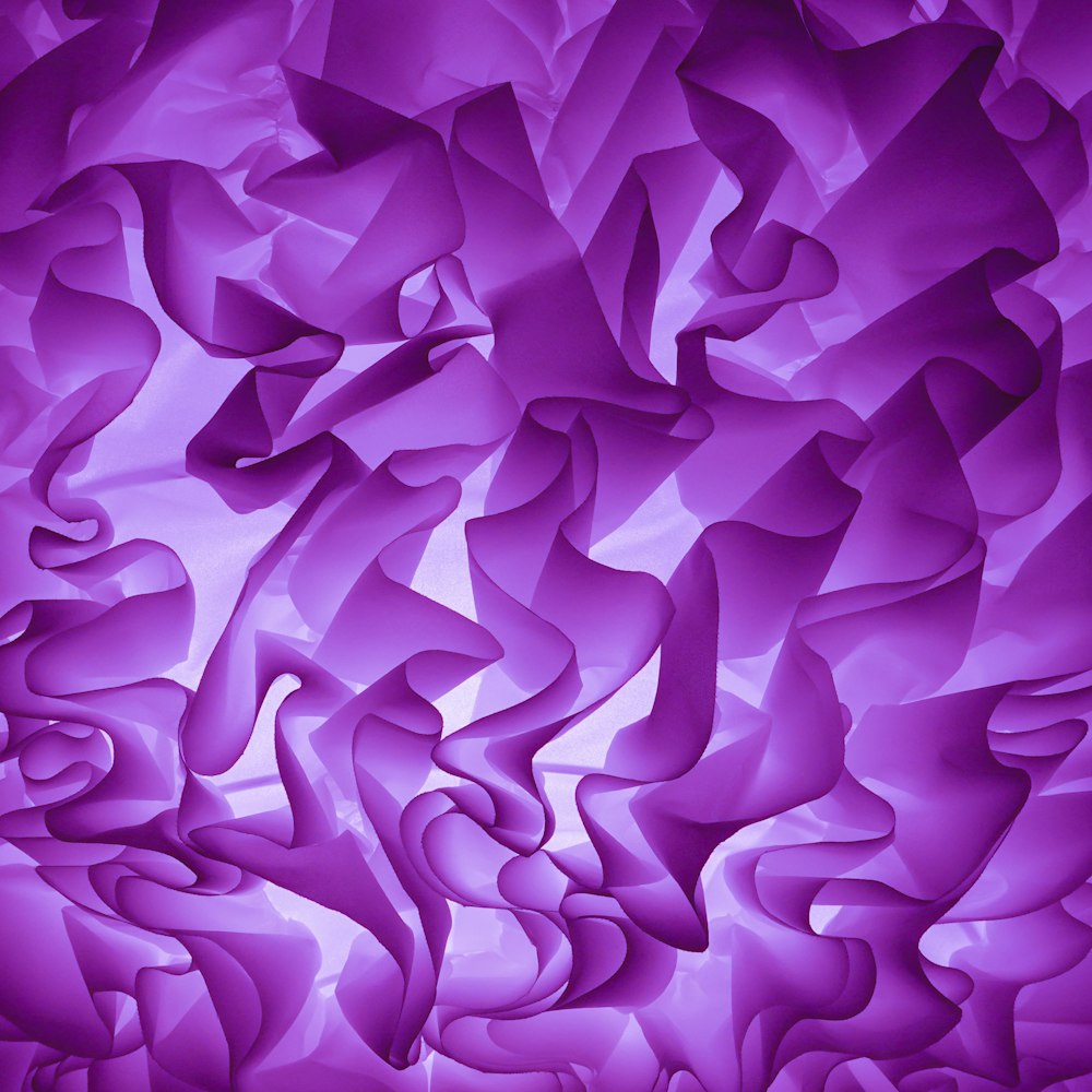 an abstract purple background with wavy lines