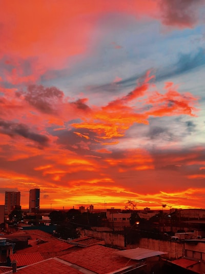 A vibrant sunset over London, showcasing iconic landmarks.