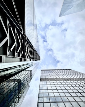 a couple of tall buildings sitting next to each other