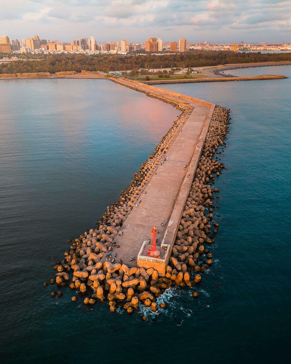 an aerial view of a pier and a body of water