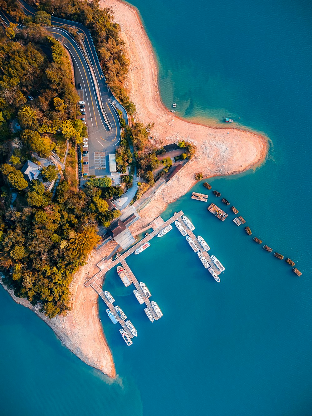 an aerial view of a boat dock on a lake