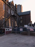 Site supervisor inspecting fire safety installations at a construction site.