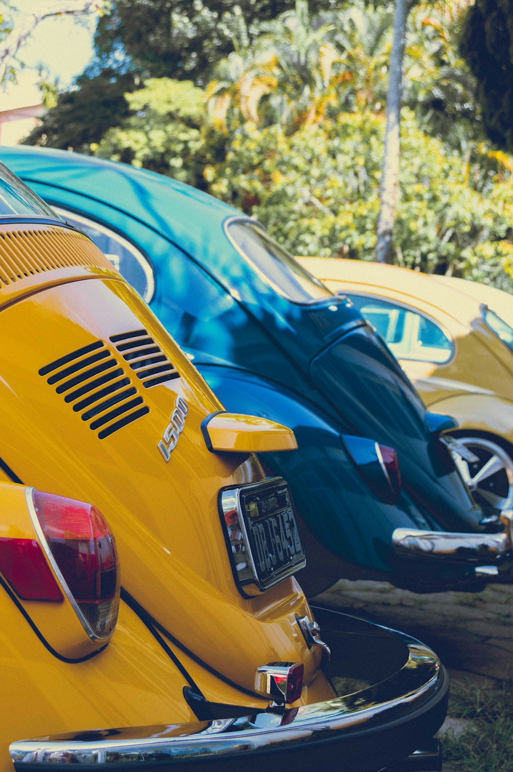 a row of parked cars sitting next to each other