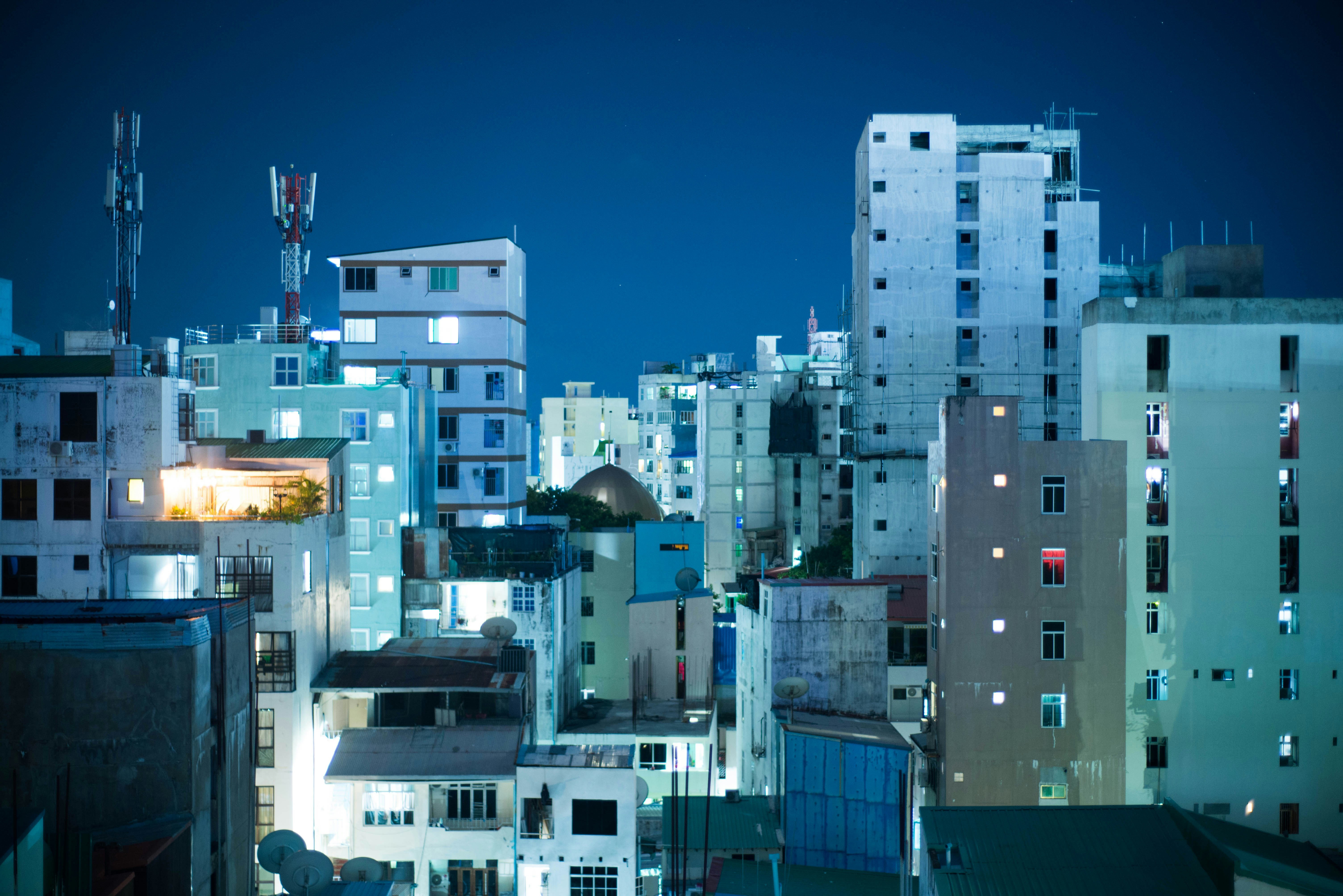 a view of a city at night from a rooftop