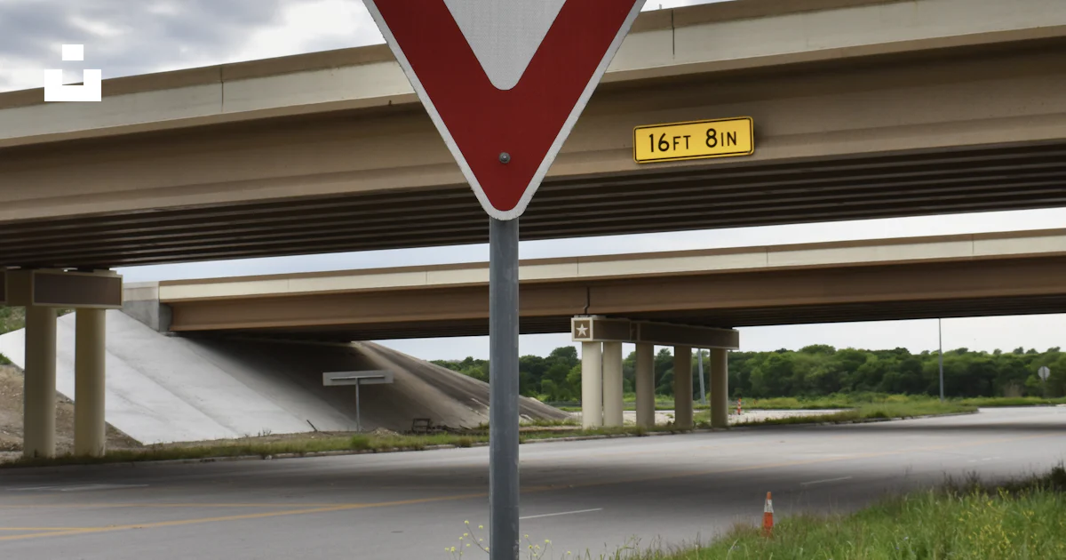 A yield sign on the side of the road photo – Free Road sign Image on ...