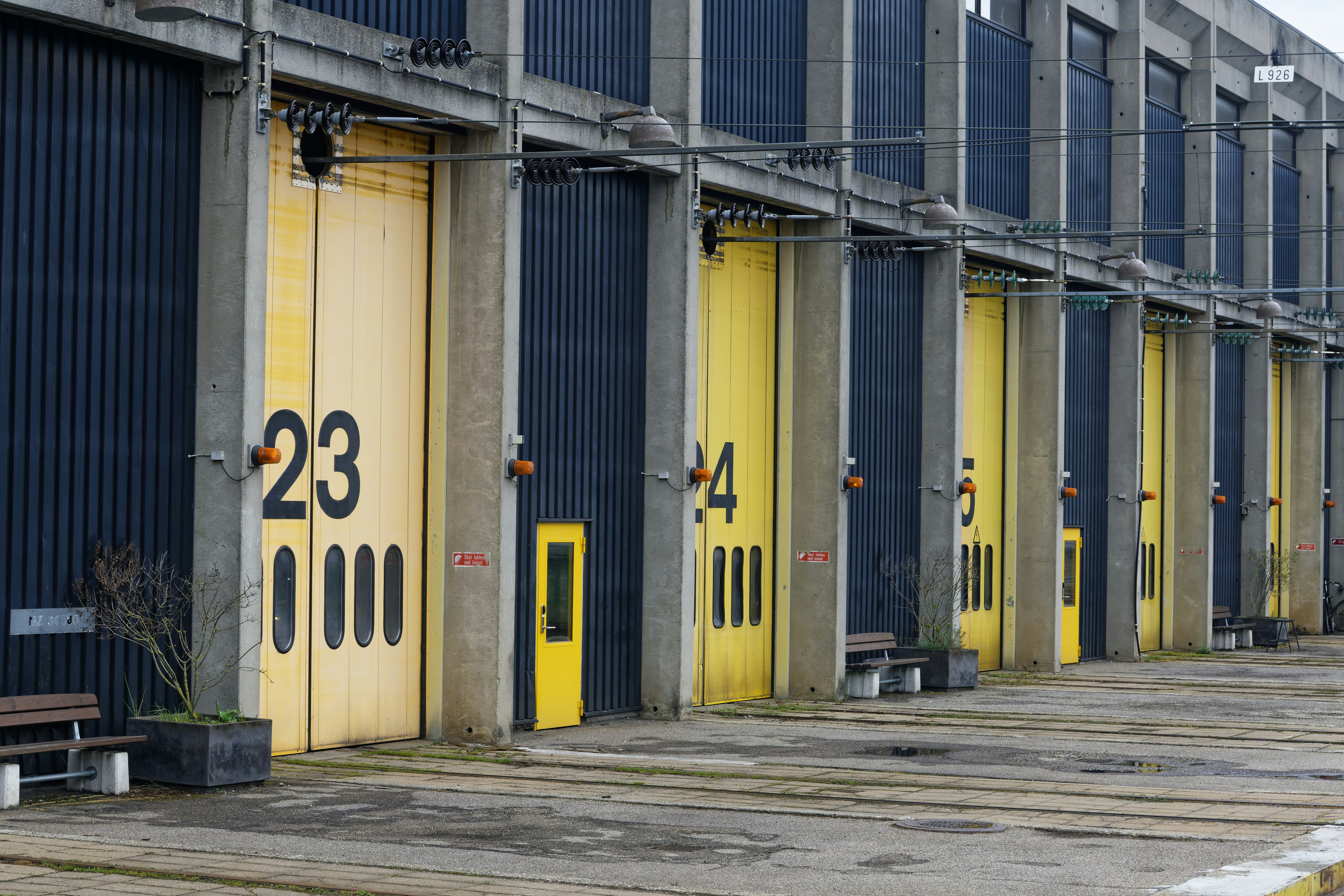 a row of yellow doors in front of a building