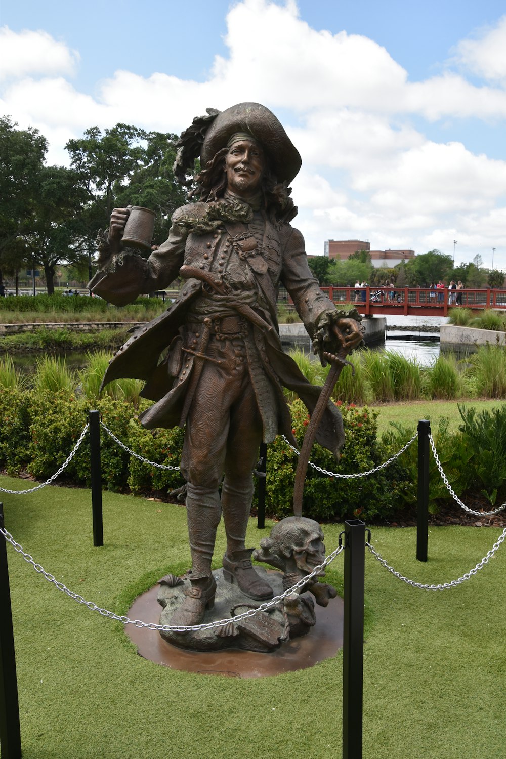 a statue of a man with a hat and a cane