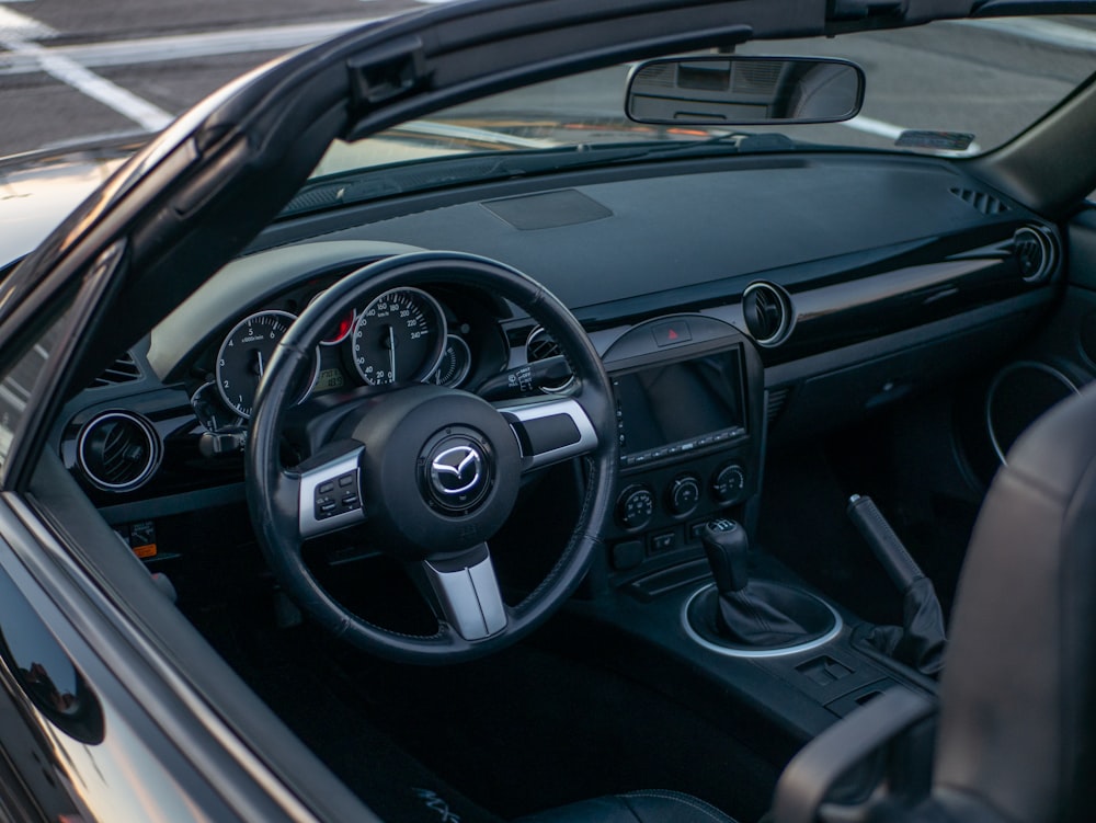 a close up of a car dashboard with a steering wheel