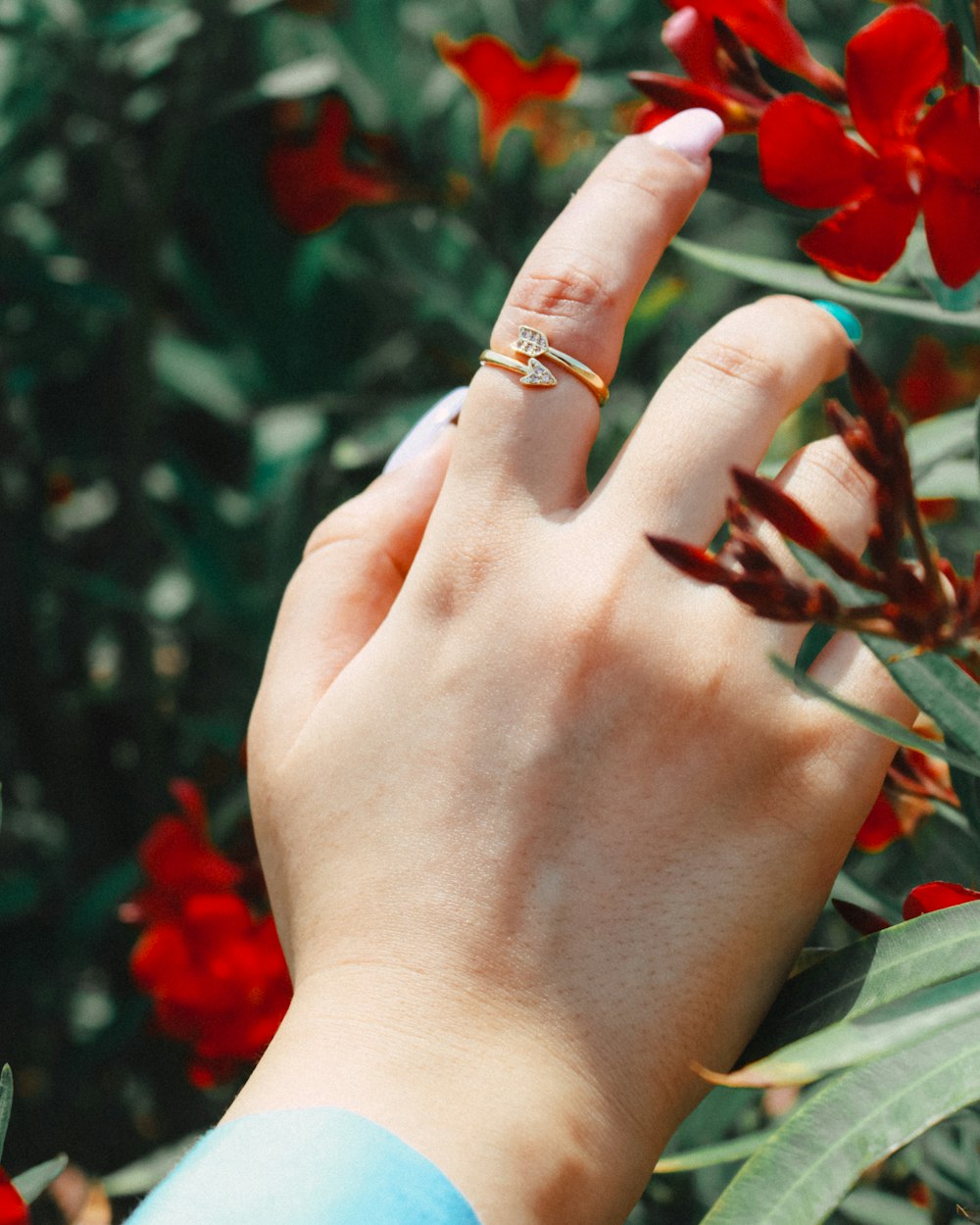 a woman's hand with a ring on her finger