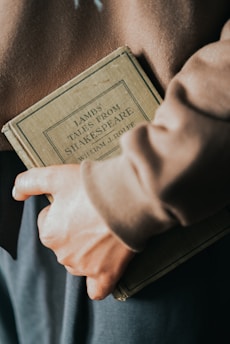 a person holding a book in their hands